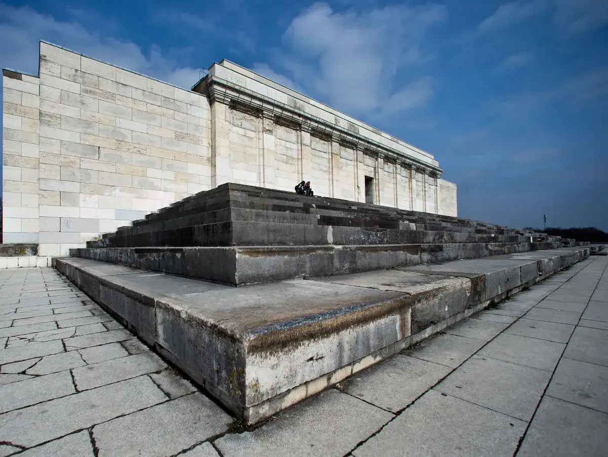 Massive stone steps lead up to a monumental building on the nuremberg rally grounds.