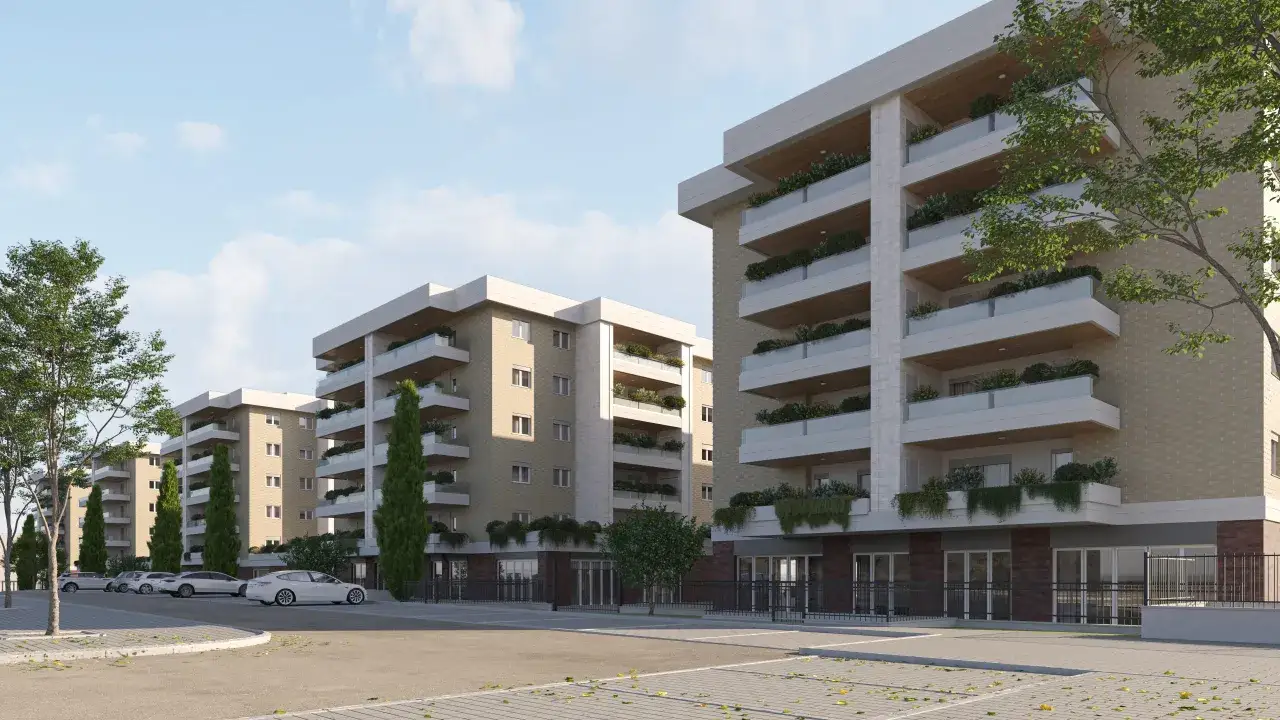 Edifici moderni con balconi verdi e alberi, un esempio di rigenerazione urbana che porta nuova vita in città.