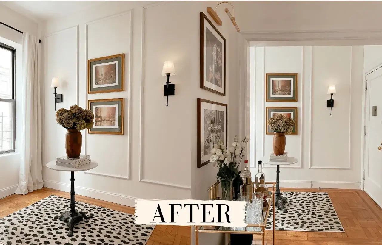 Elegant entryway with added molding to walls, featuring framed art, sconces, a bar cart, and a leopard print rug.