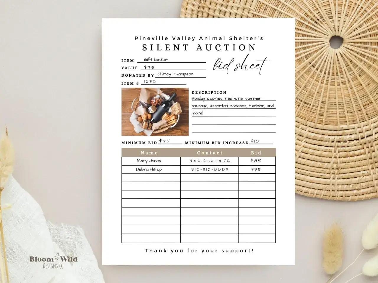 A bid sheet for a fundraising silent auction, featuring a gift basket with wine, cookies, and more.