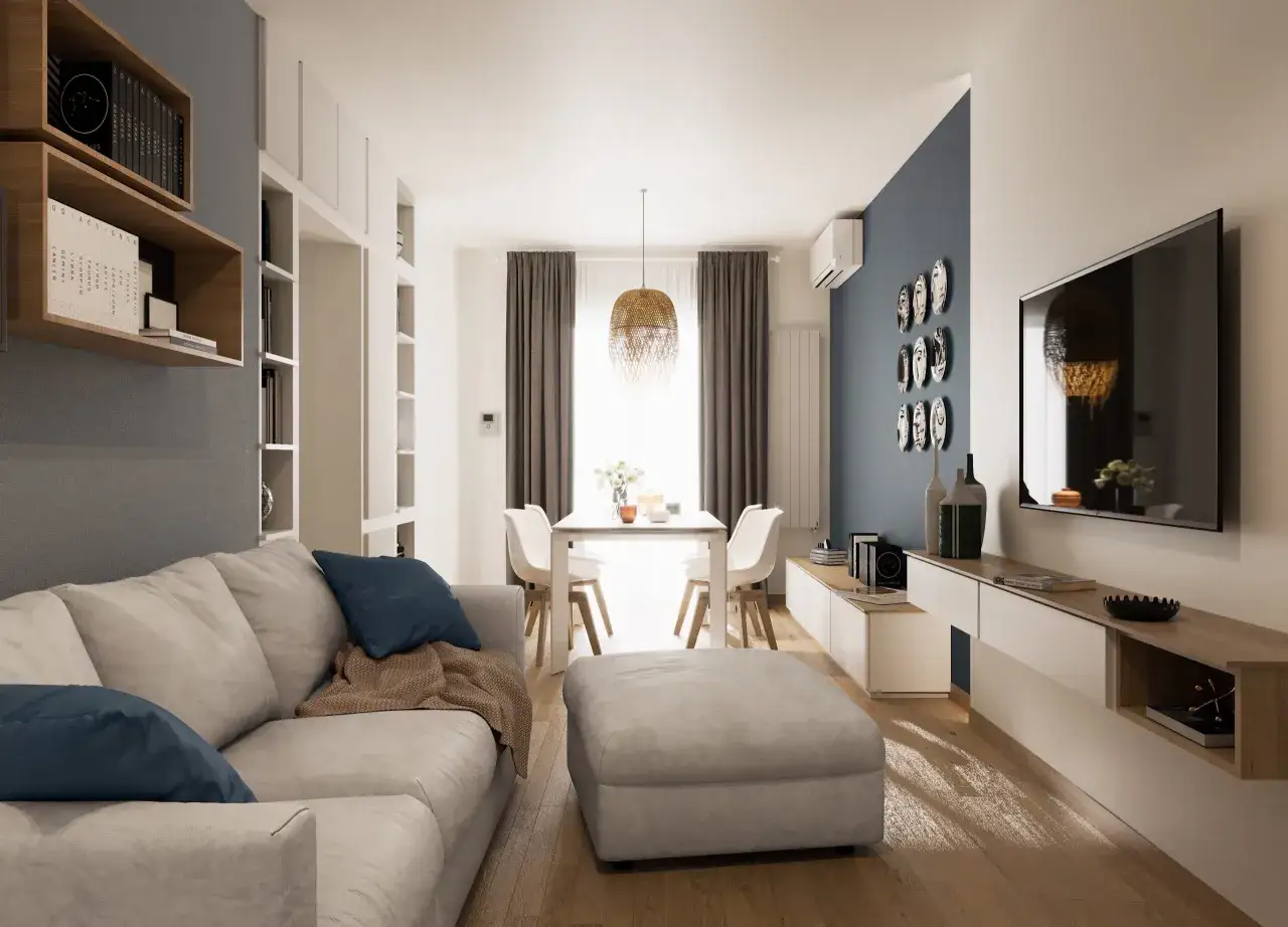 Soggiorno moderno con divano chiaro, pouf, tavolo da pranzo e libreria. La palette colori neutri arredamento crea un'atmosfera rilassante.