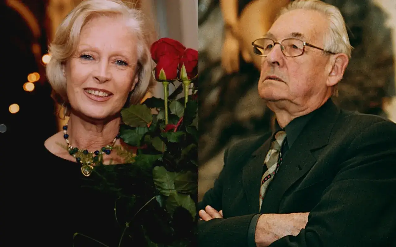 Uśmiechnięta Krystyna Zachwatowicz, żona Andrzeja Wajdy, z bukietem czerwonych róż. Obok niej, w garniturze, sam reżyser.