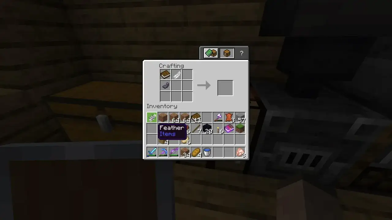 Jak zrobic ksiazke z piorem w MC: crafting book and feather. W ekwipunku masz pi&oacute;ro i sk&oacute;rę, potrzebne do stworzenia księgi.