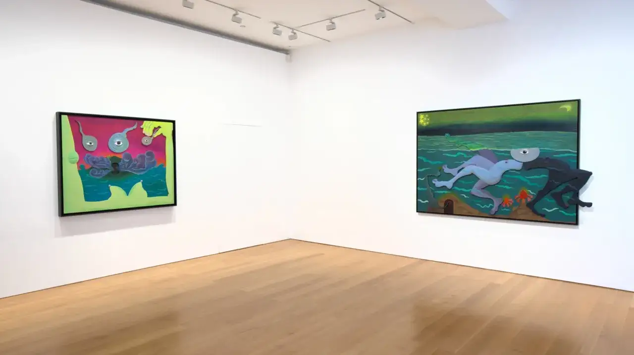 Two surreal paintings by Alexandria Smith hang on white gallery walls, one with eyes and abstract forms, the other with figures in a green, watery landscape.