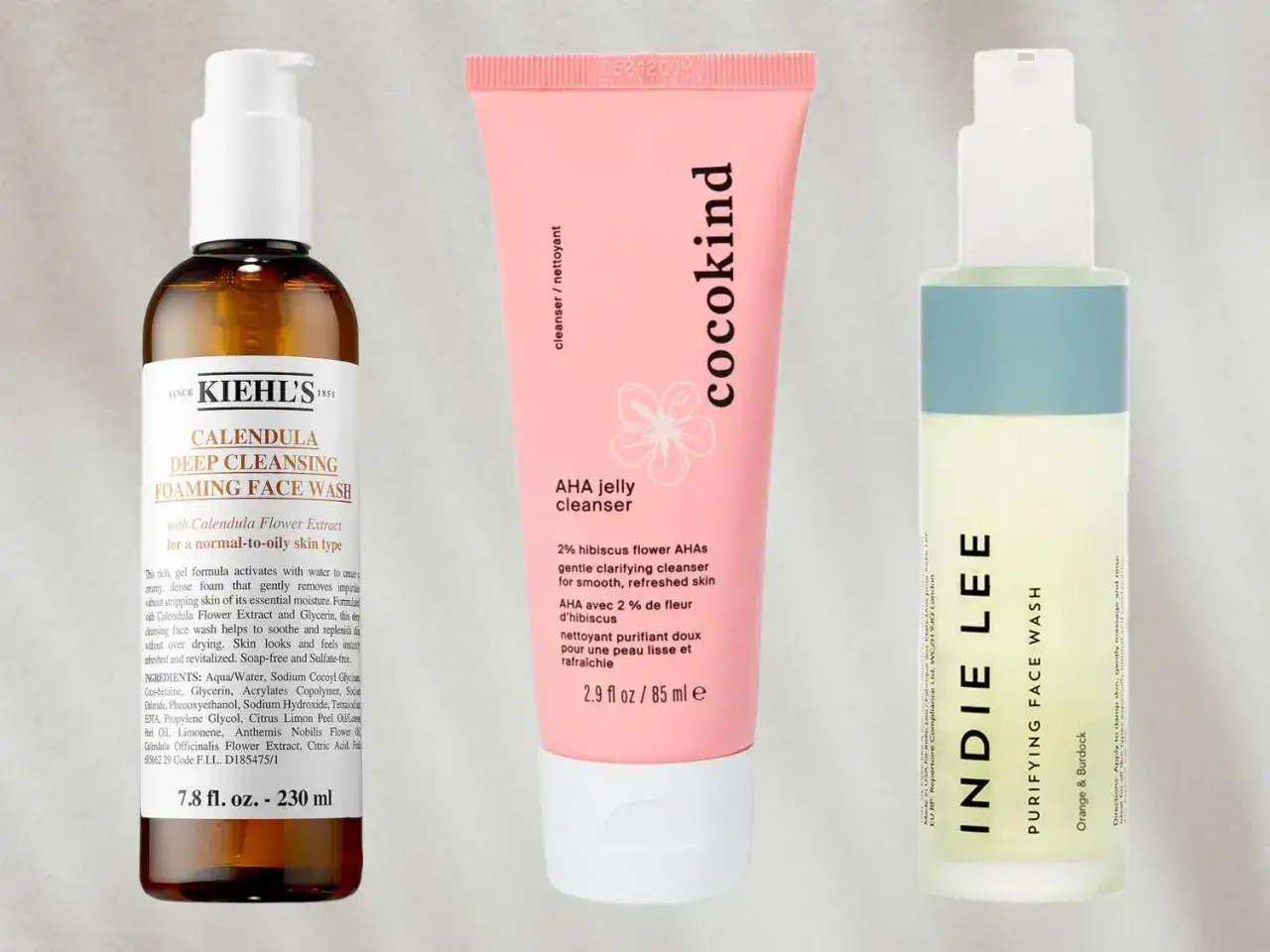 Trois nettoyants visage : Kiehl's Calendula, Cocokind AHA, Indie Lee Purifying. Des options pour savoir avec quoi se laver le visage naturellement.