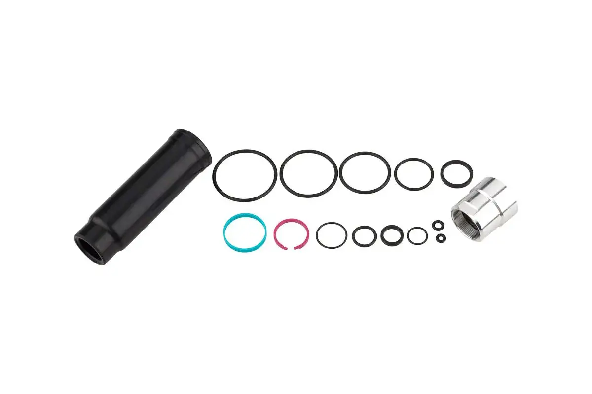 Parts for Fox 34 service: black sleeve, various O-rings (including blue and pink), and a silver threaded cap.