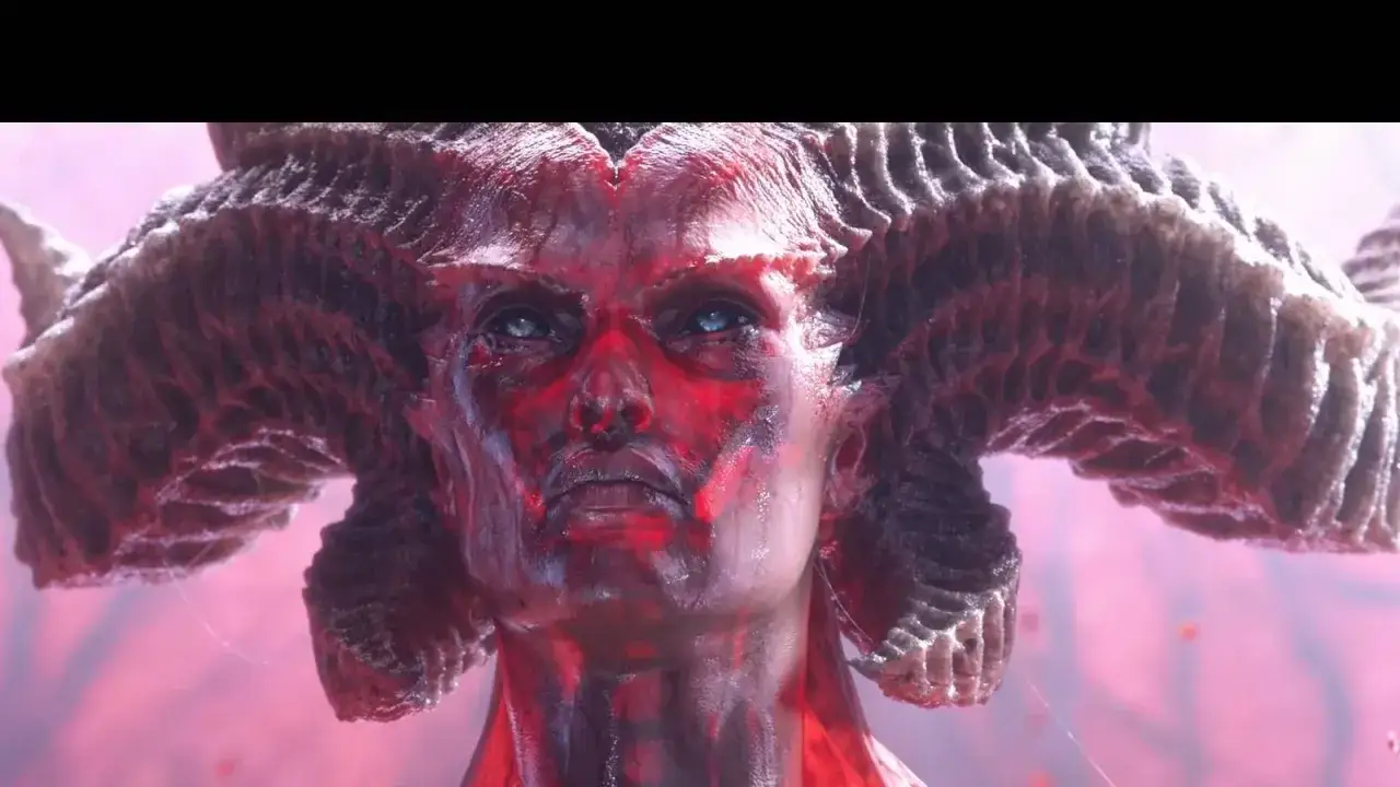 Lilith, la Madre de los Demonios de Diablo 4, con su rostro rojo y ojos azules penetrantes, coronada por enormes cuernos.