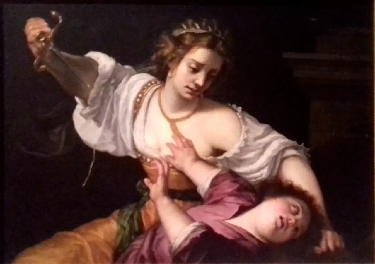 Medea, med en dolk i handen, står över en fallen person. En dramatisk scen som skildrar Medeas hämnd.