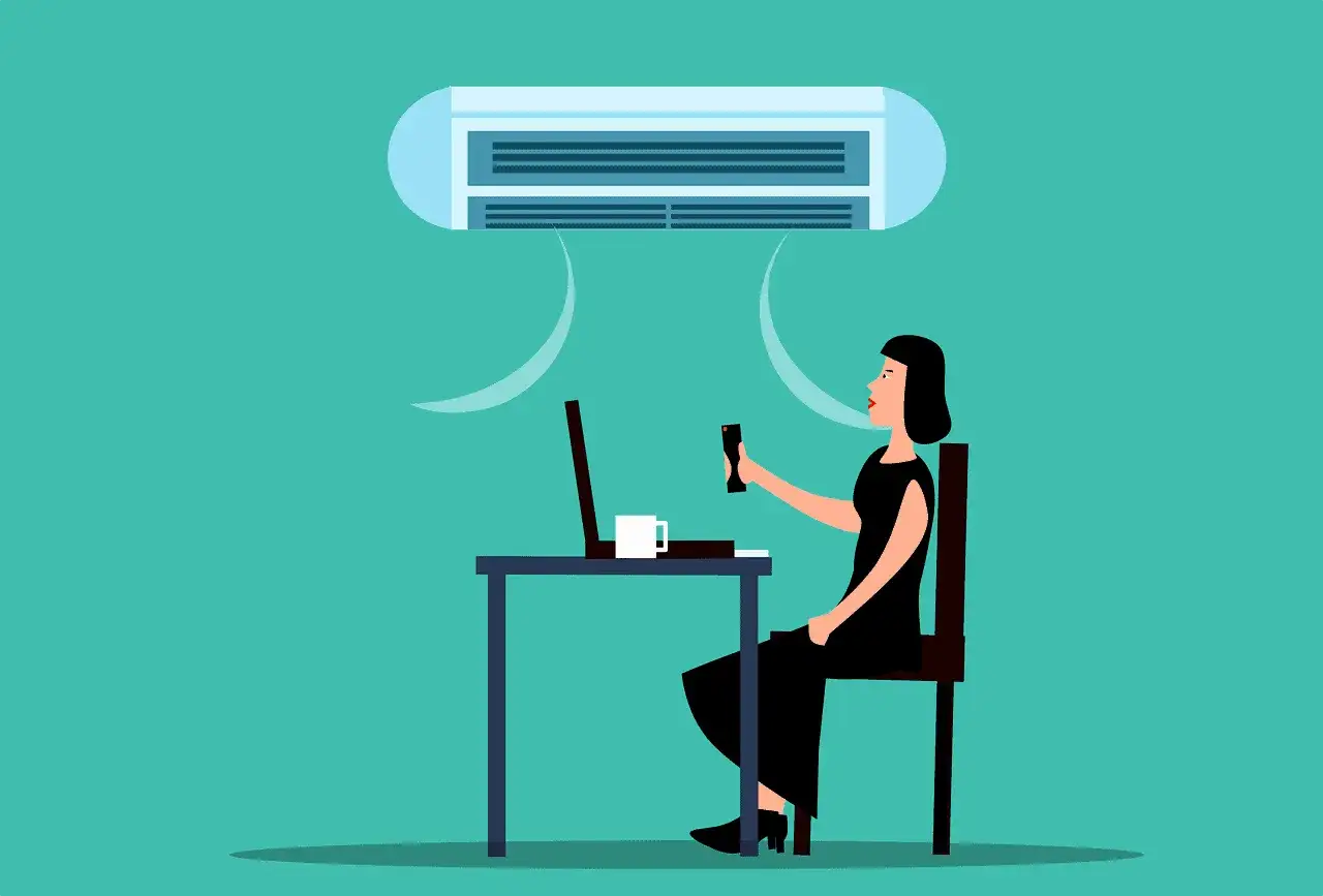 Femme au bureau ajustant la climatisation pour une température minimum travail idéale.