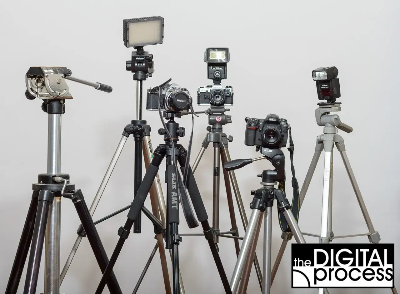 A collection of cameras and tripods, illustrating how to choose a tripod for your photography needs.