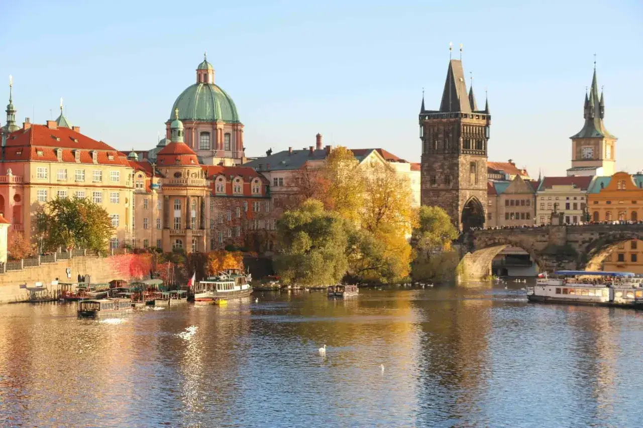 A beautiful view of Prague's Old Town with the Charles Bridge and Vltava River, perfect for a prague free walking tour.