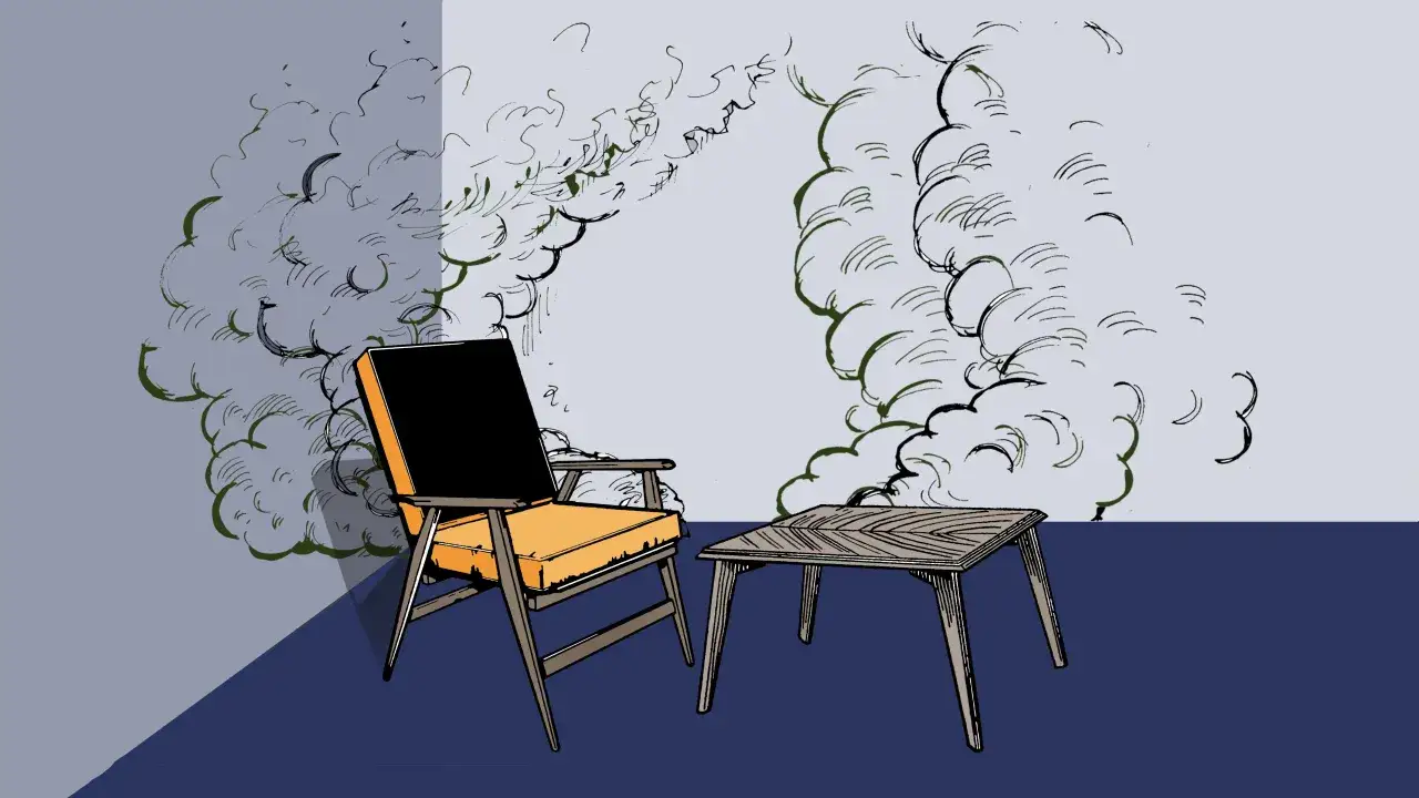 An orange and black chair and a wooden table are depicted with swirling green and black lines suggesting **off-gassing** or smoke.