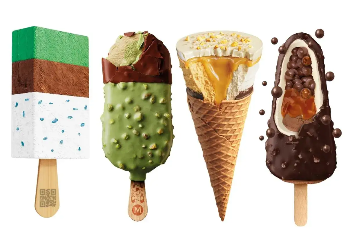 H&auml;r &auml;r glassnyheter 2026: en flerlagerspinne med bl&aring;tt str&ouml;ssel, en gr&ouml;n pistageglass med choklad, en kolaglass i strut och en chokladglass med krispiga kulor.