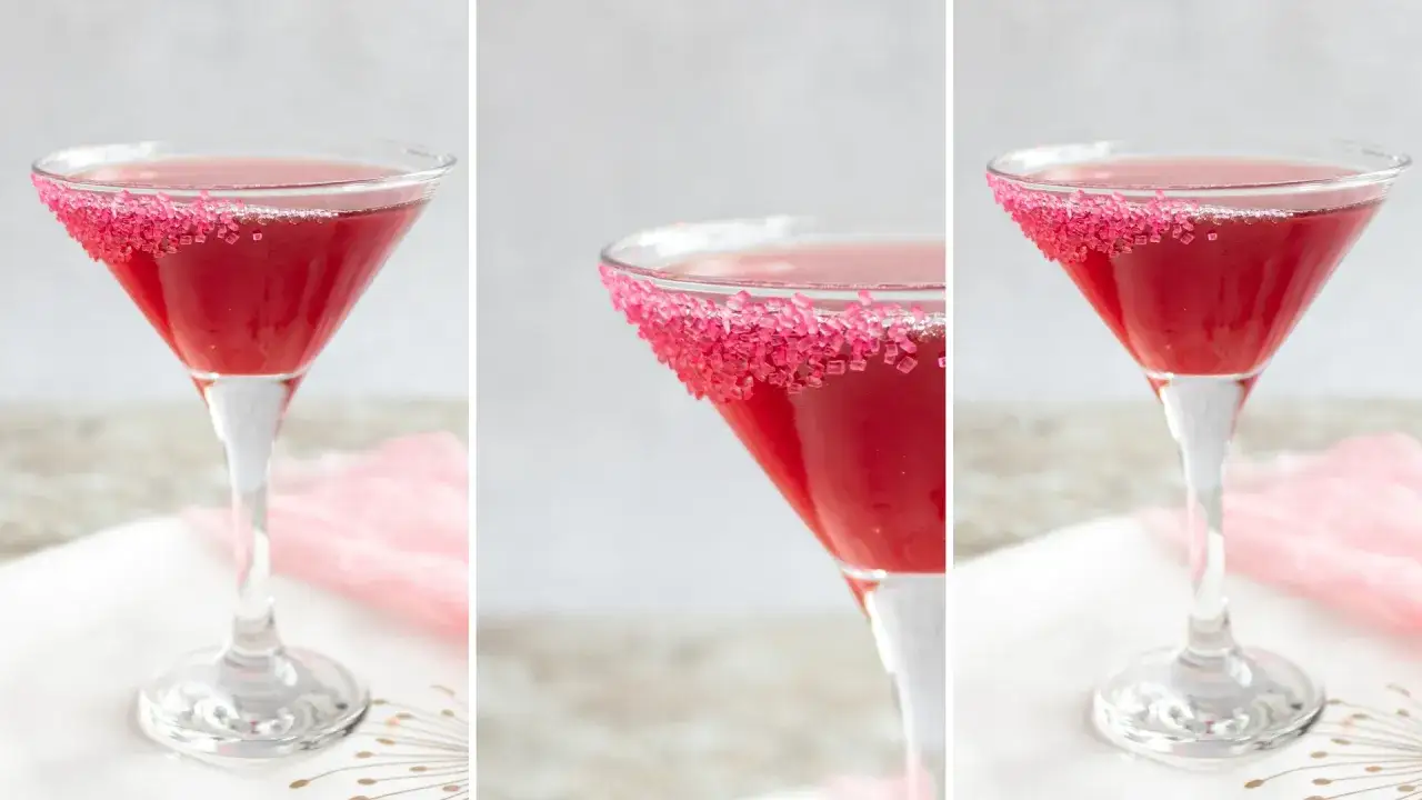 Elegancki drink z granatem, ozdobiony różowym cukrem na kieliszku. Idealny na specjalne okazje.