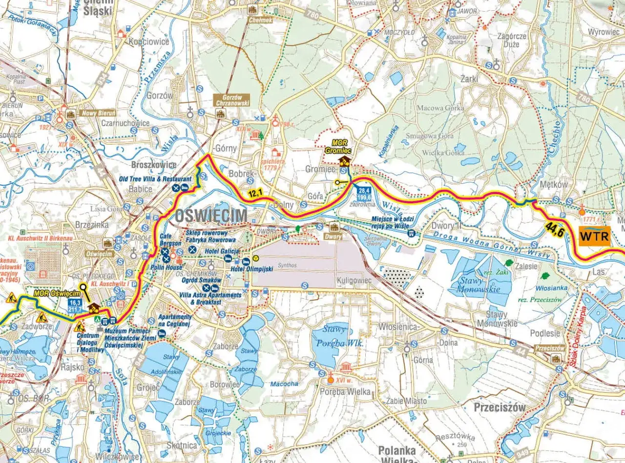 Mapa turystyczna Małopolski z zaznaczonymi atrakcjami, drogami wodnymi Wisły i szlakami rowerowymi. Widać Oświęcim, Muzeum Auschwitz-Birkenau i szlak Velo Małopolska.