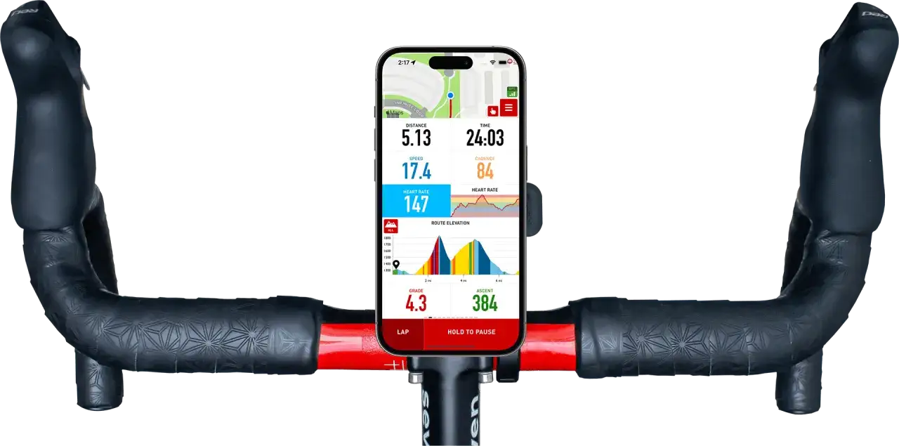 Aplikacja licznik rowerowy na telefonie pokazuje dystans 5.13 km, czas 24:03, prędkość 17.4 km/h i tętno 147.