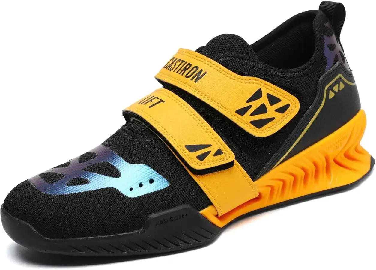 Czarne buty sportowe z żółtymi rzepami i pomarańczową podeszwą. Idealne, jeśli zastanawiasz się, jakie buty na siłownię wybrać.