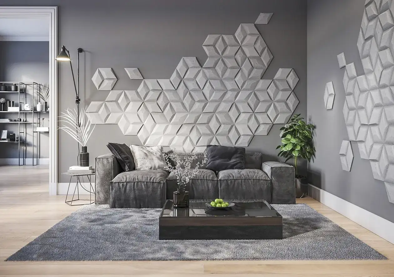 Nowoczesny salon z szarą sofą i stolikiem kawowym. Główną ozdobą jest geometryczna, trójwymiarowa ozdobna ściana w salonie.
