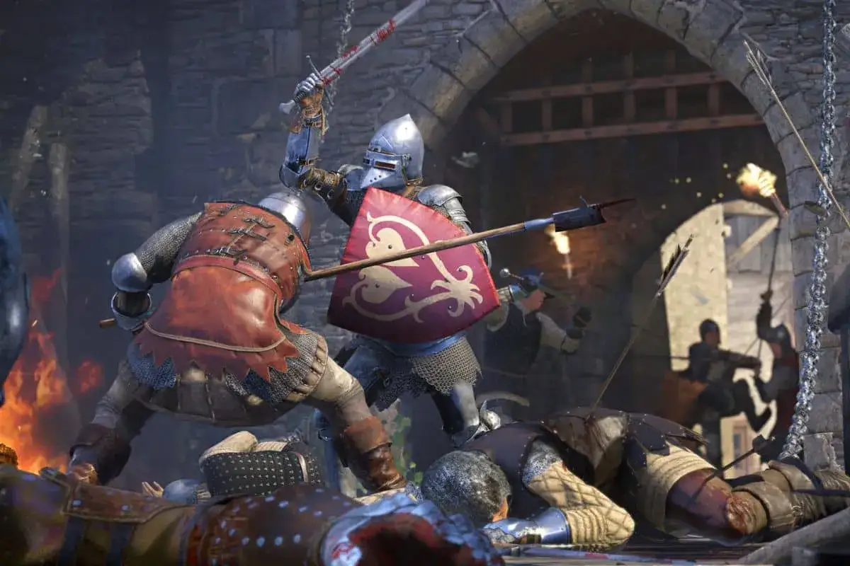Intensywna bitwa w Kingdom Come: Deliverance. Rycerze w zbrojach walczą mieczami i tarczami, a pokonani leżą na ziemi.