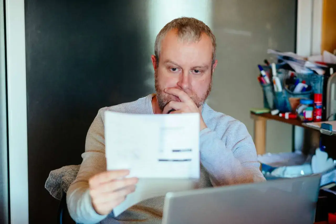 Person looking worried about loan application or credit score
