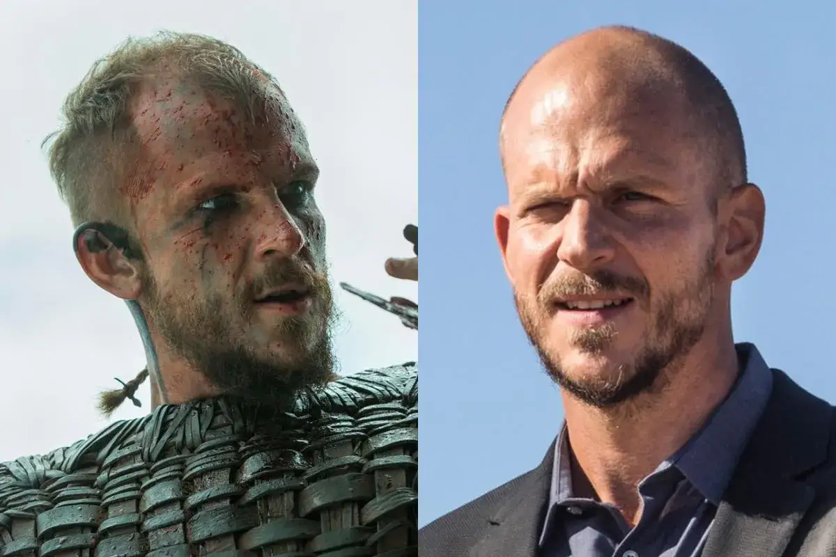 Floki w zbroi, z krwią na twarzy, obok uśmiechniętego mężczyzny w garniturze.