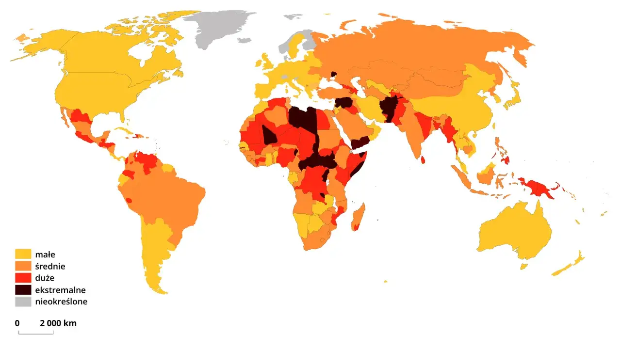 Mapa świata z zaznaczonymi poziomami bezpieczeństwa. Czy w Iraku jest bezpiecznie? Mapa pokazuje, że Irak jest oznaczony kolorem czerwonym, co oznacza wysokie ryzyko.