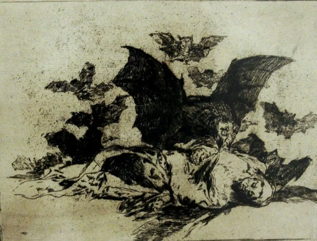 Un homme gît, assailli par des chauves-souris, évoquant les sombres phares Baudelaire. L'obscurité et la peur dominent cette gravure.