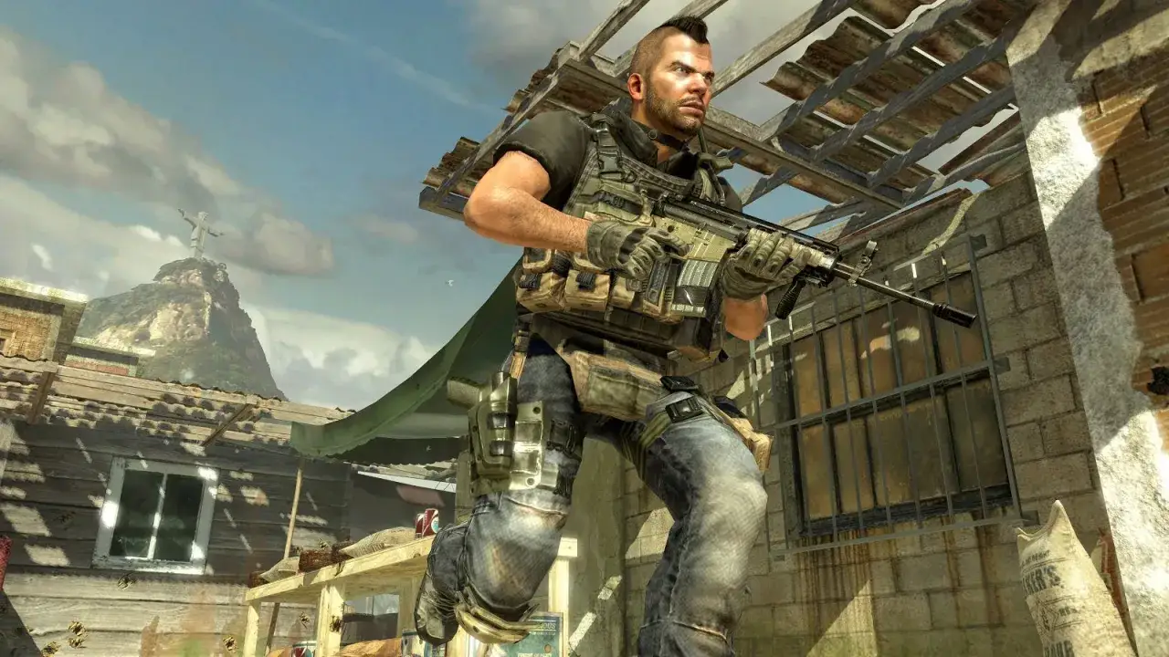 Żołnierz z karabinem w Call of Duty Warzone Mobile, na tle g&oacute;rzystego krajobrazu z posągiem Chrystusa Odkupiciela.