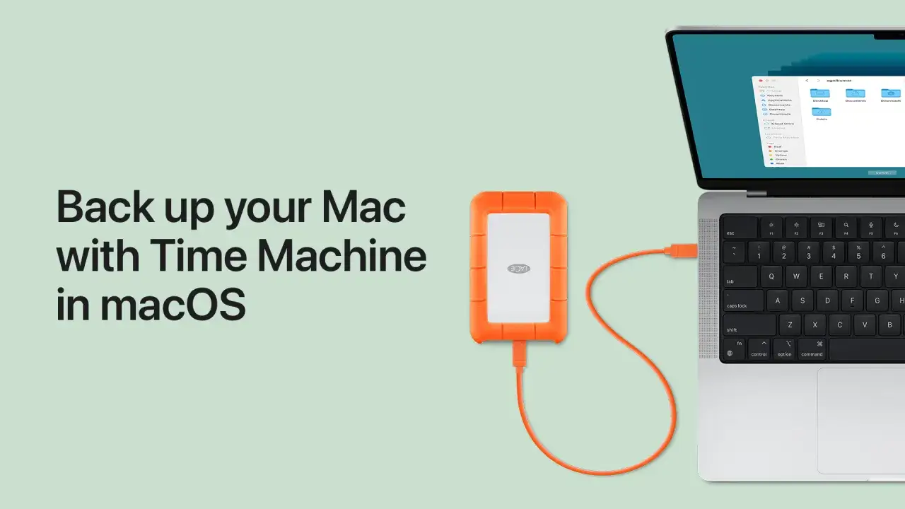 Disco externo naranja conectado a un Mac para hacer un backup con Time Machine.