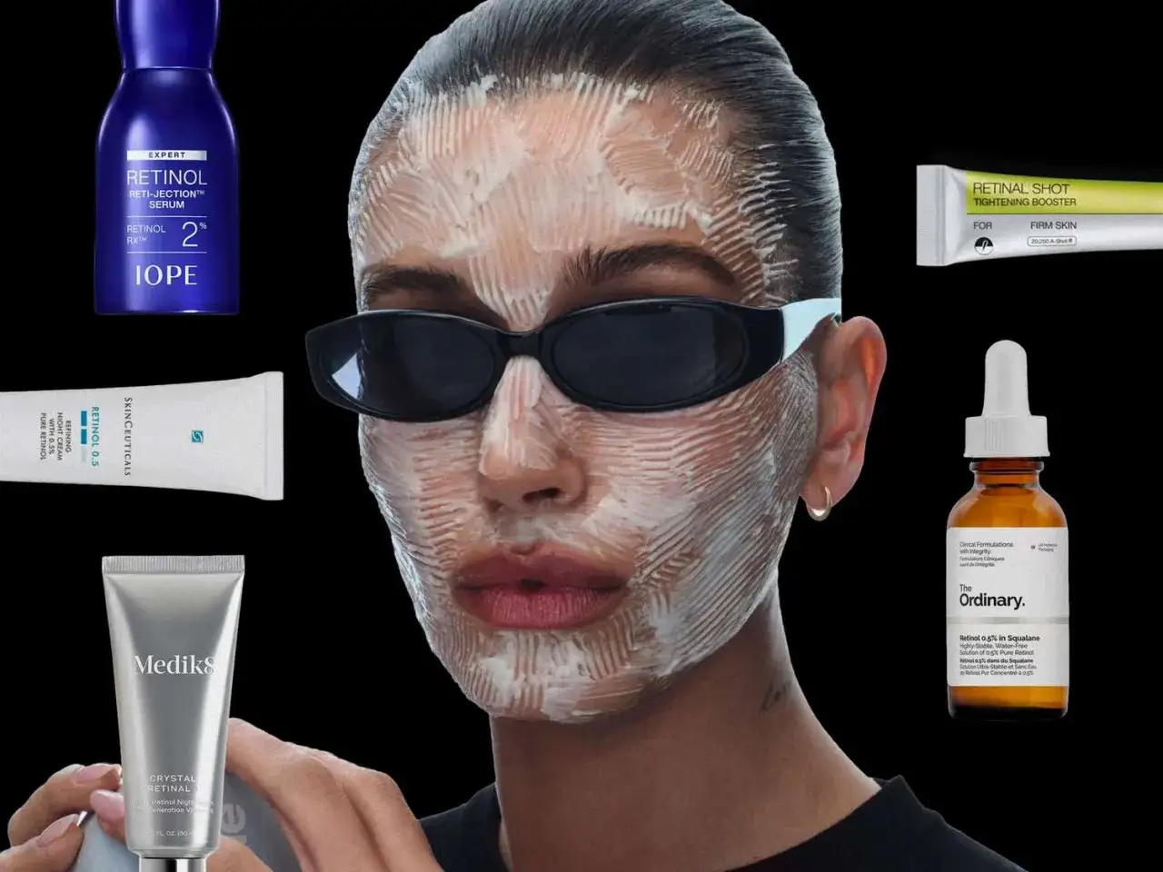 Ein Model mit Gesichtsmaske und Sonnenbrille, umgeben von verschiedenen Retinol-Produkten, darunter ein gutes Retinol Serum von The Ordinary.