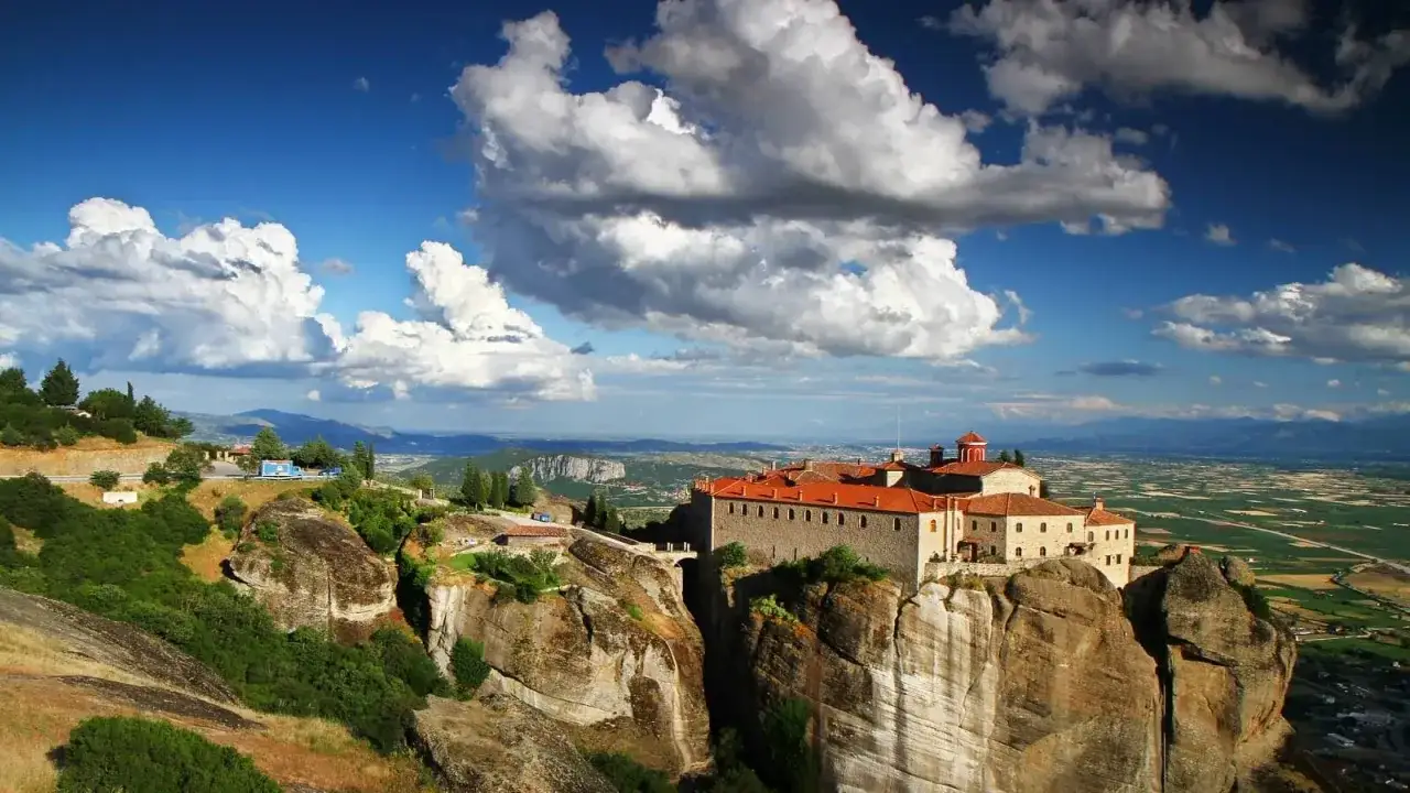 Monastery perched on a cliff in Meteora, Greece. The stunning landscape makes the meteora price of admission feel like a bargain.