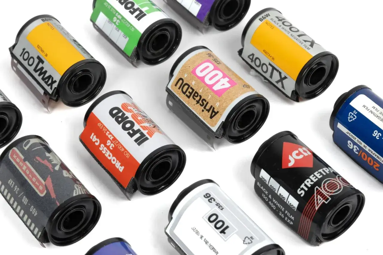 A collection of 35mm film rolls, including Kodak T-Max, Ilford, Arista.EDU, and JCH Streetpan, ready for capturing the best black and white film moments.