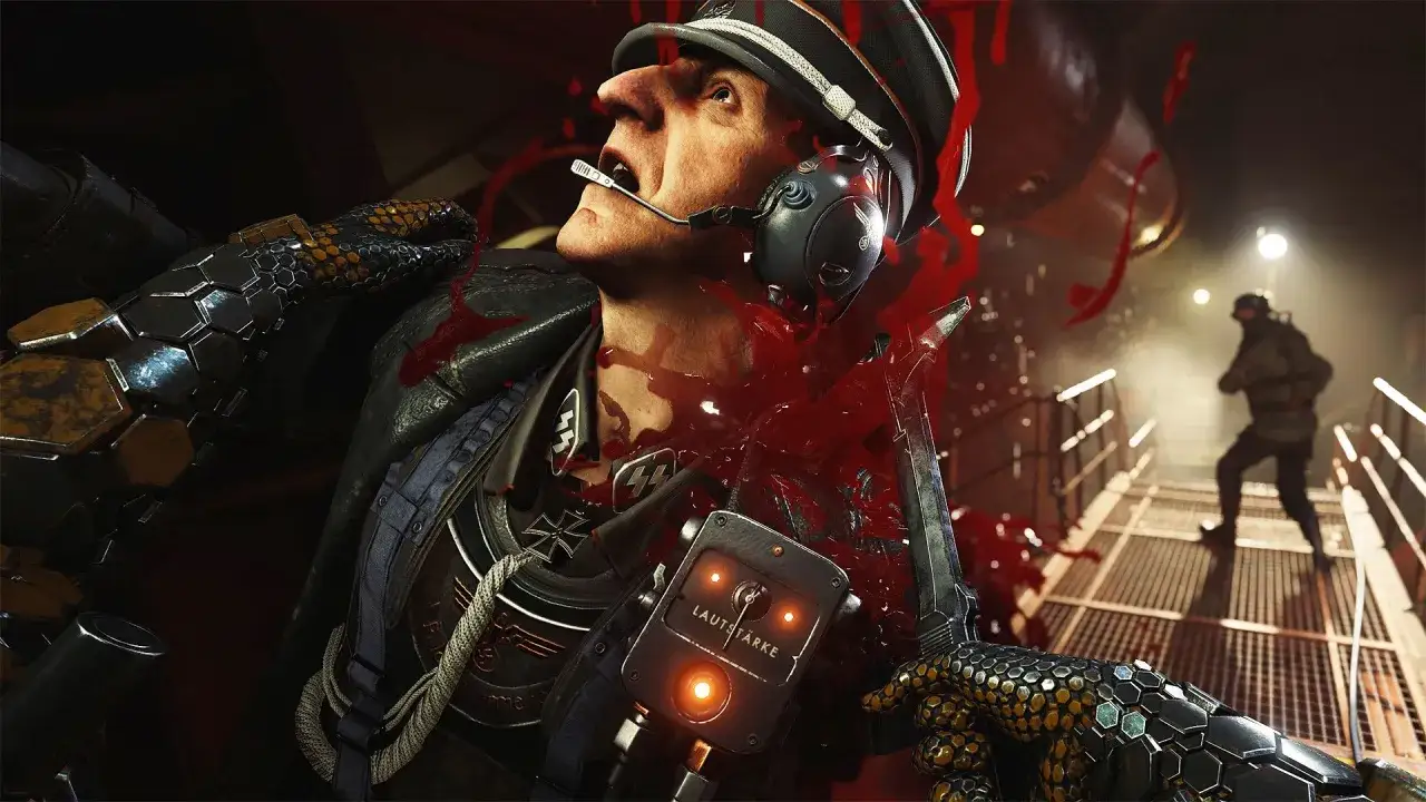 Brutalna scena z Wolfenstein 3: gracz przebija nazistowskiego oficera, krew tryska na ekran.