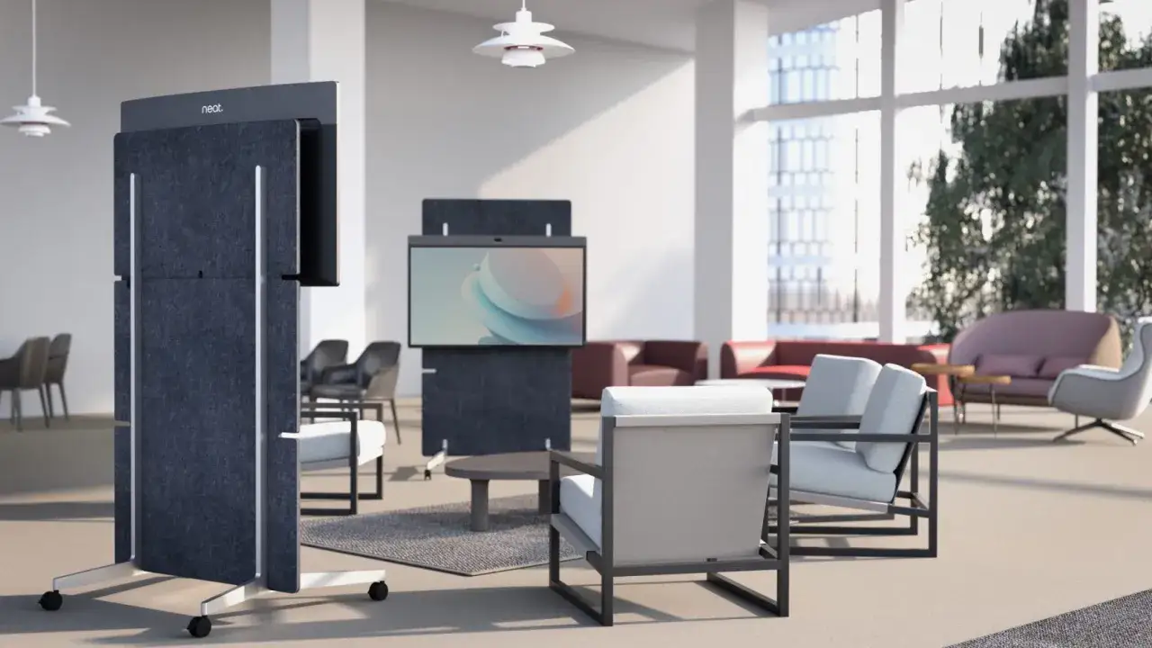 Modern board meeting setup with mobile screens and comfortable seating.