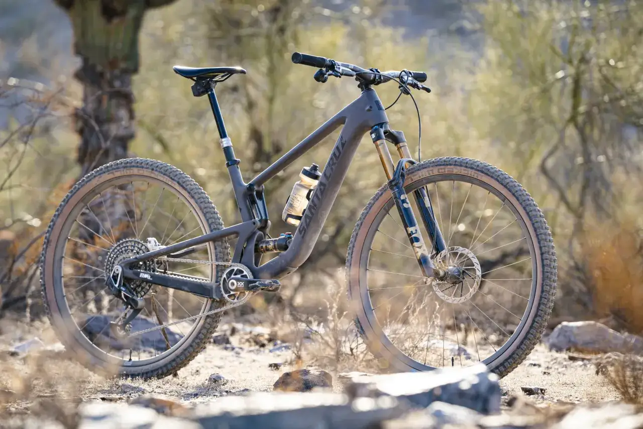 A Santa Cruz mountain bike with a Fox Float SL shock sits on a dusty trail, ready for adventure.