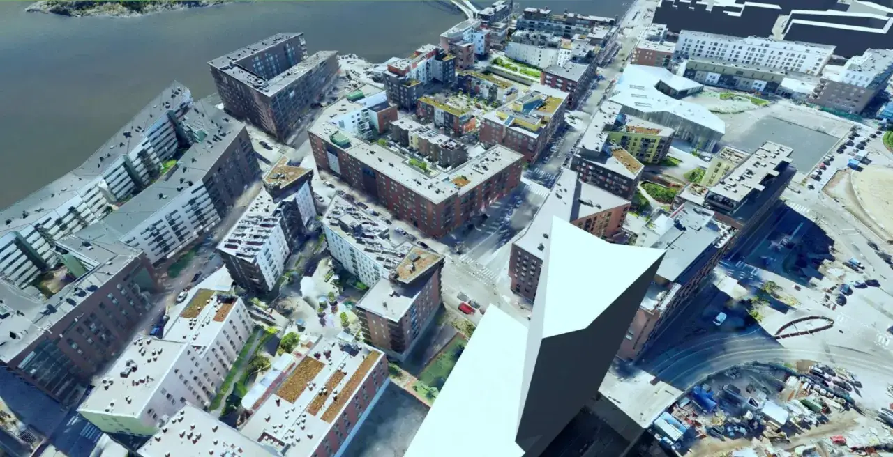 Luftaufnahme einer Stadt mit modernen Gebäuden, die als **modellprojekte smart cities** dienen.