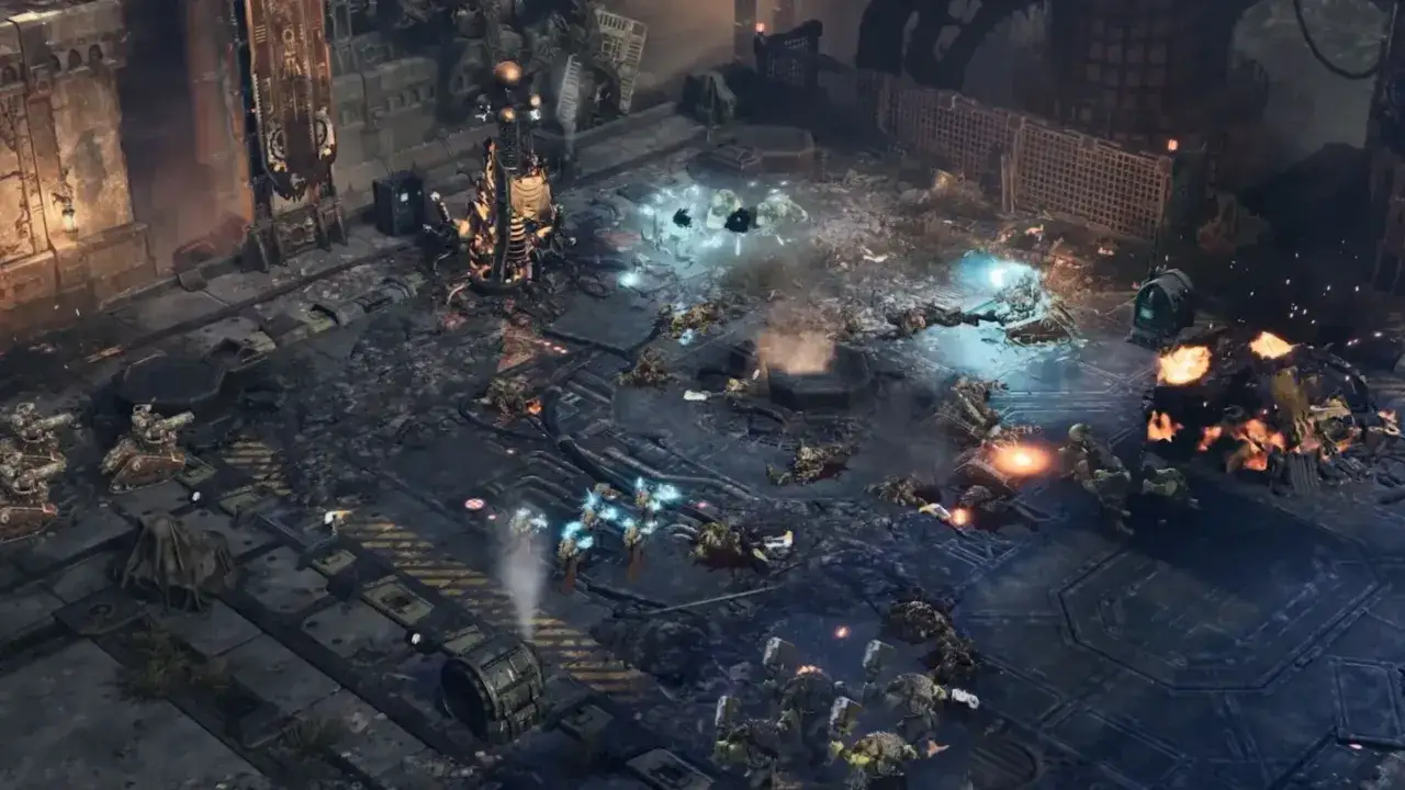 Bitwa w świecie Dawn of War 4. Żołnierze walczą wśr&oacute;d zniszczeń, eksplozji i poległych towarzyszy.
