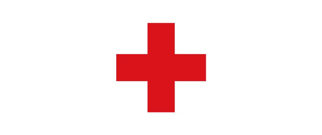 Czerwony krzyż na białym tle. Symbol przypominający o tym, jak się przeżegnać, zaczynając od czoła.