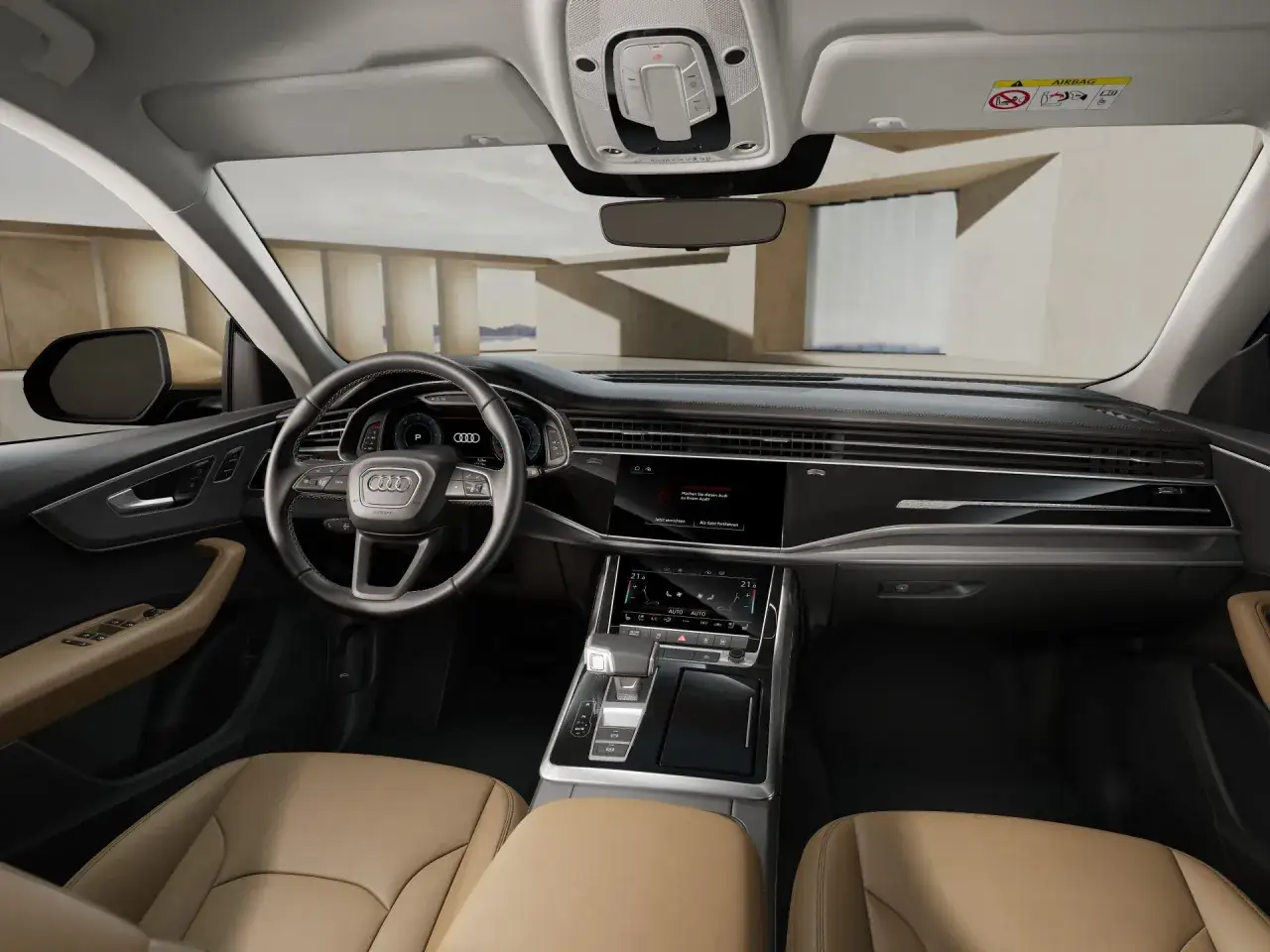 Wnętrze Audi Q8 z beżową skórzaną tapicerką i nowoczesnym panelem sterowania. Sprawdź audi q8 cena i poczuj luksus.
