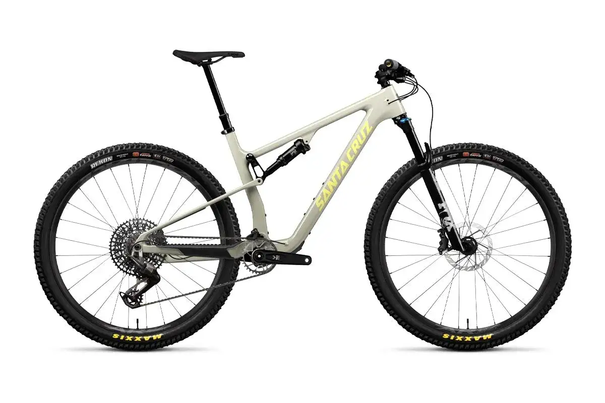 A light grey Santa Cruz Blur mountain bike, ready for a review, with yellow