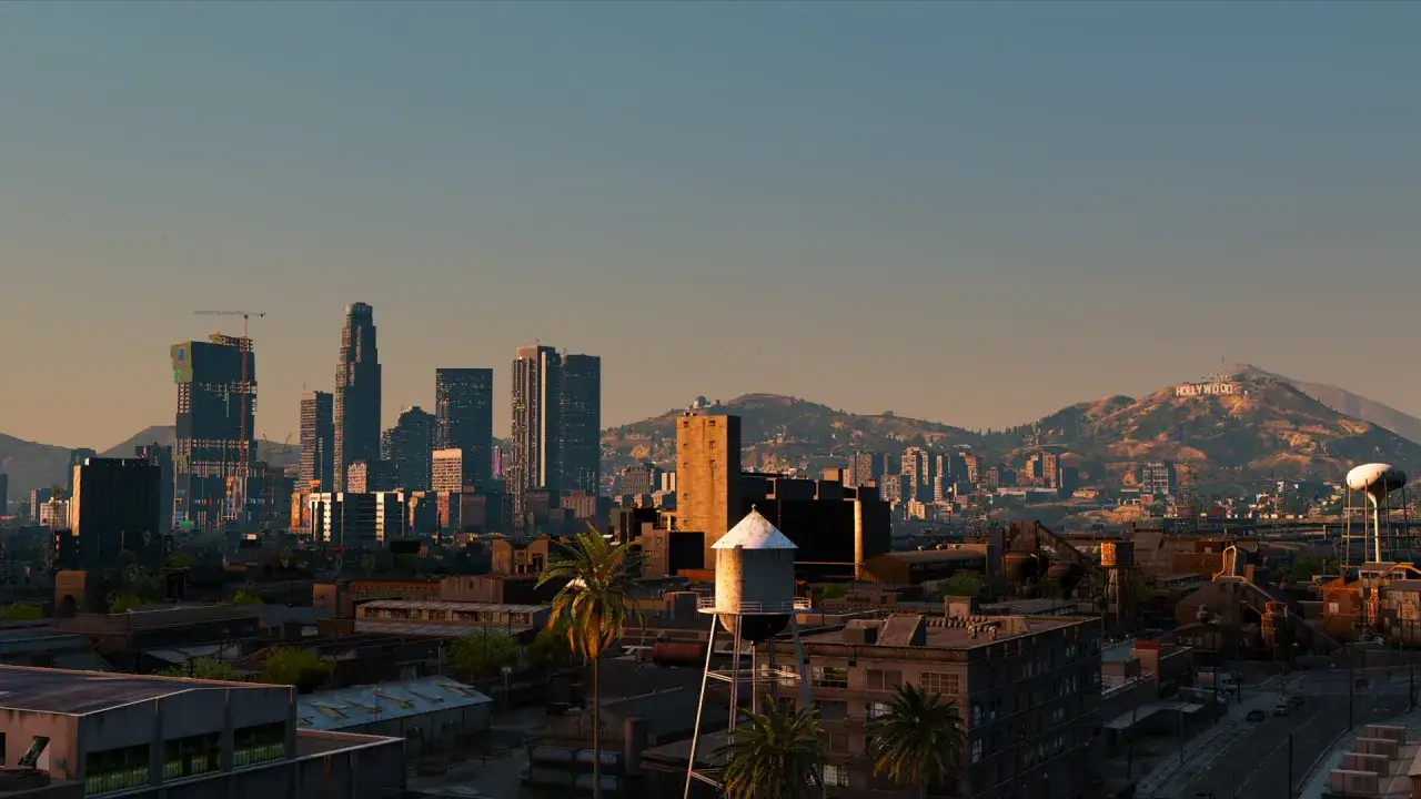 Los Angeles w zachodzącym słońcu, z górami i napisem Hollywood w tle. Idealne miejsce do odkrywania najlepszych modów do GTA 5.