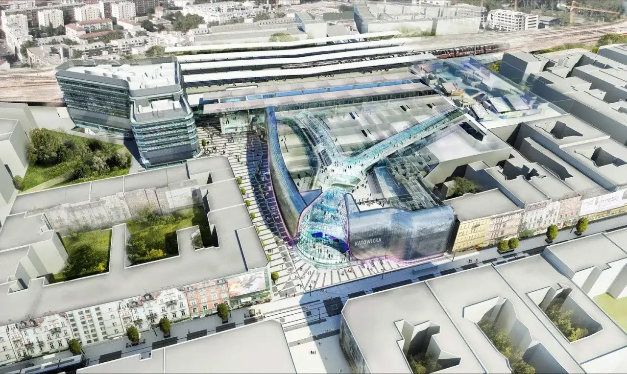 Nowoczesny dworzec PKP Katowice-dojazd z przeszklonymi łącznikami i zielonymi dachami.