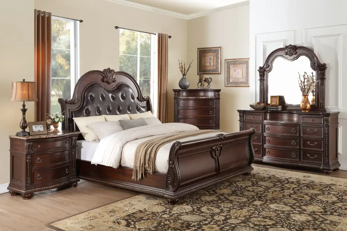 Elegant bedroom with a dark wood bed and matching nightstands. The nightstands have a marble top and ornate carvings, complementing the rich wood of the bed.