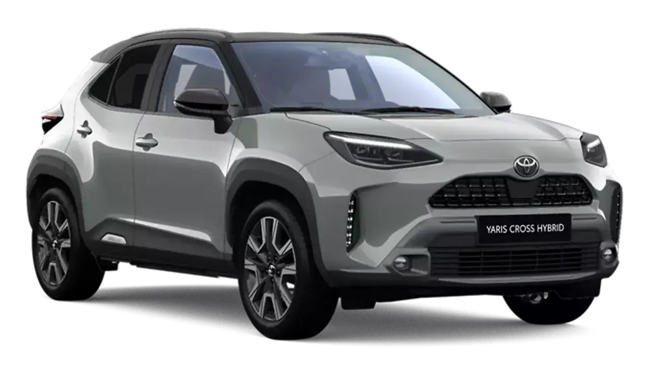 Srebrny Toyota Yaris Cross Hybrid z czarnym dachem, gotowy na miejskie przygody.
