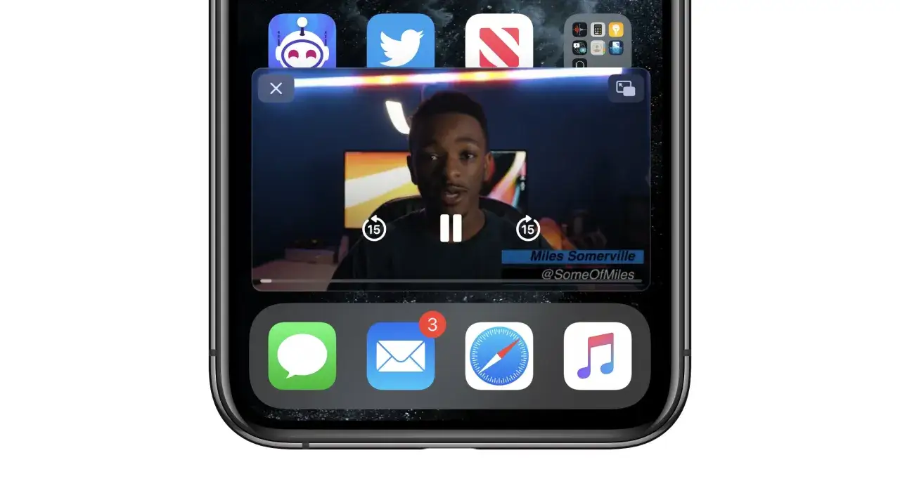 Bild i bild på iPhone visar en ung man som pratar i en video. Nedanför syns app-ikoner för meddelanden, e-post, Safari och musik.