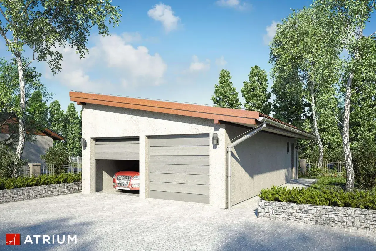Nowoczesny garaż murowany z dwoma bramami, jedna otwarta, ukazująca czerwony samochód. Otoczony zielenią i podjazdem z kostki.