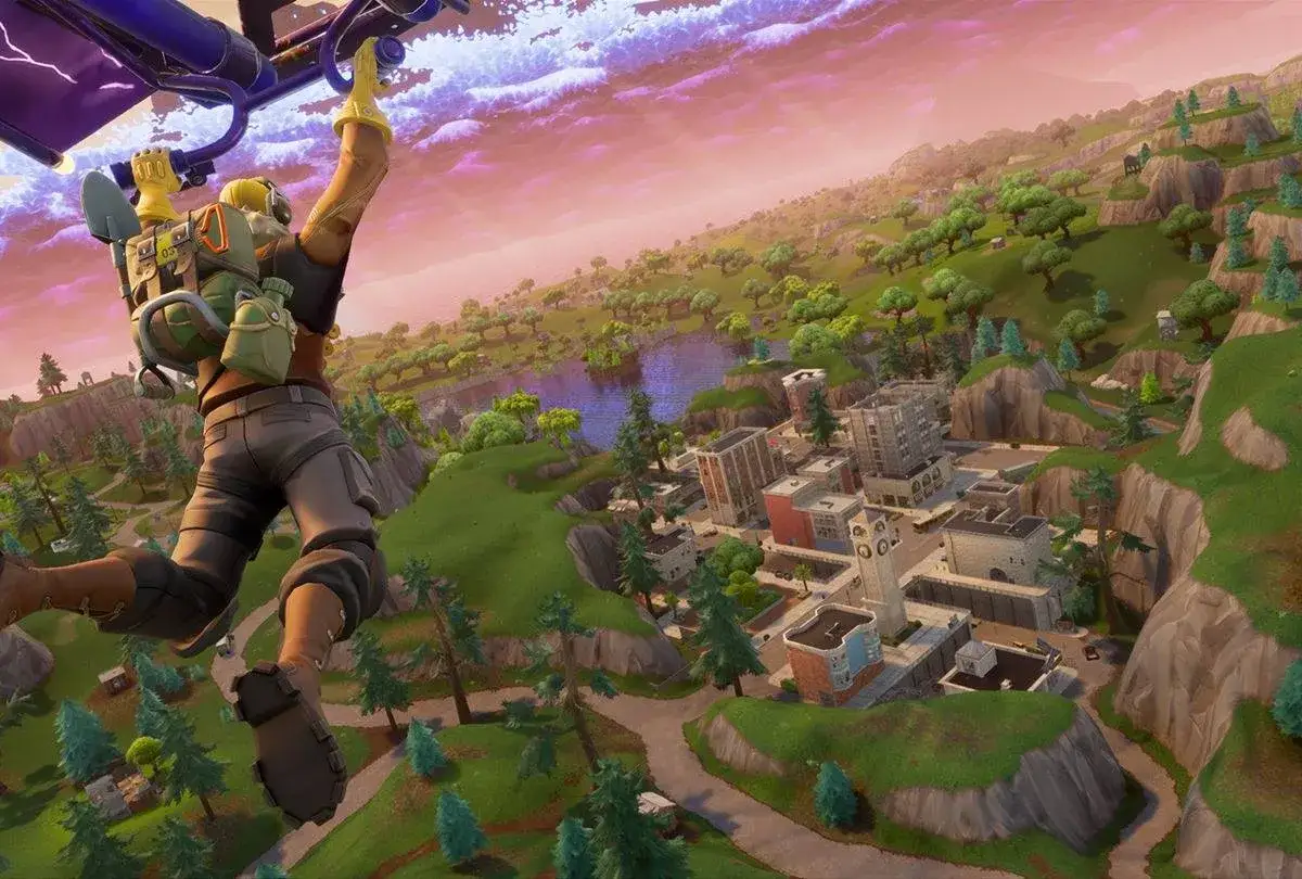 Gracz skacze ze spadochronem nad miastem w grze Fortnite. Chcesz wiedzieć, jak zainstalować Fortnite?