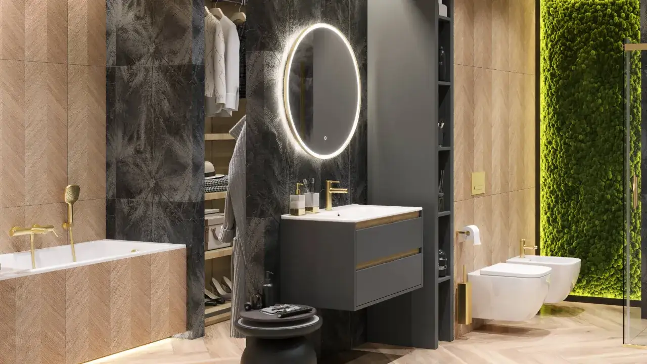 Nowoczesna łazienka z wanną, umywalką i złotymi bateriami. Owalne lustra łazienkowe złote z podświetleniem dodają elegancji.