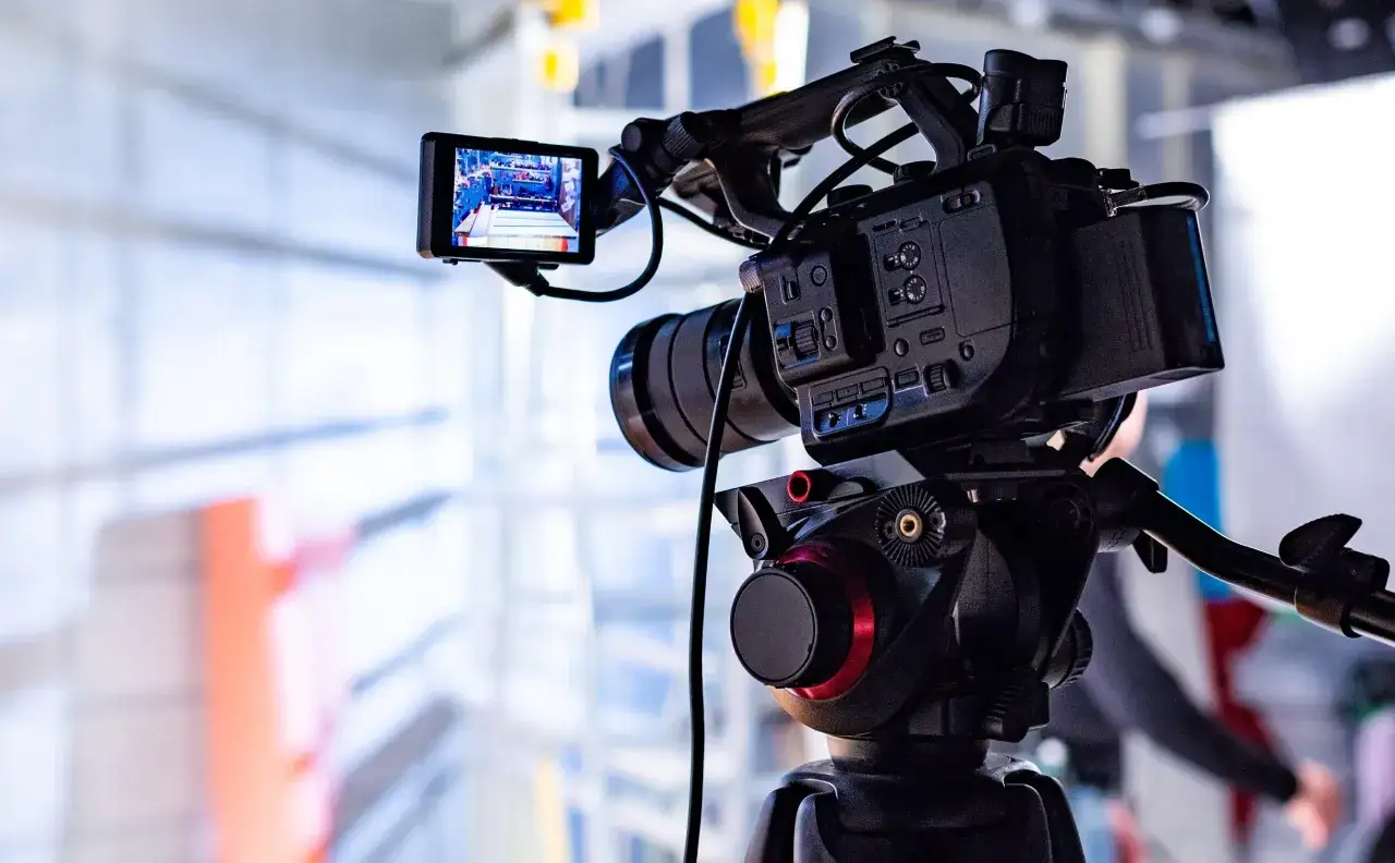 Professional video camera set up to record local government events, capturing important proceedings for public access.