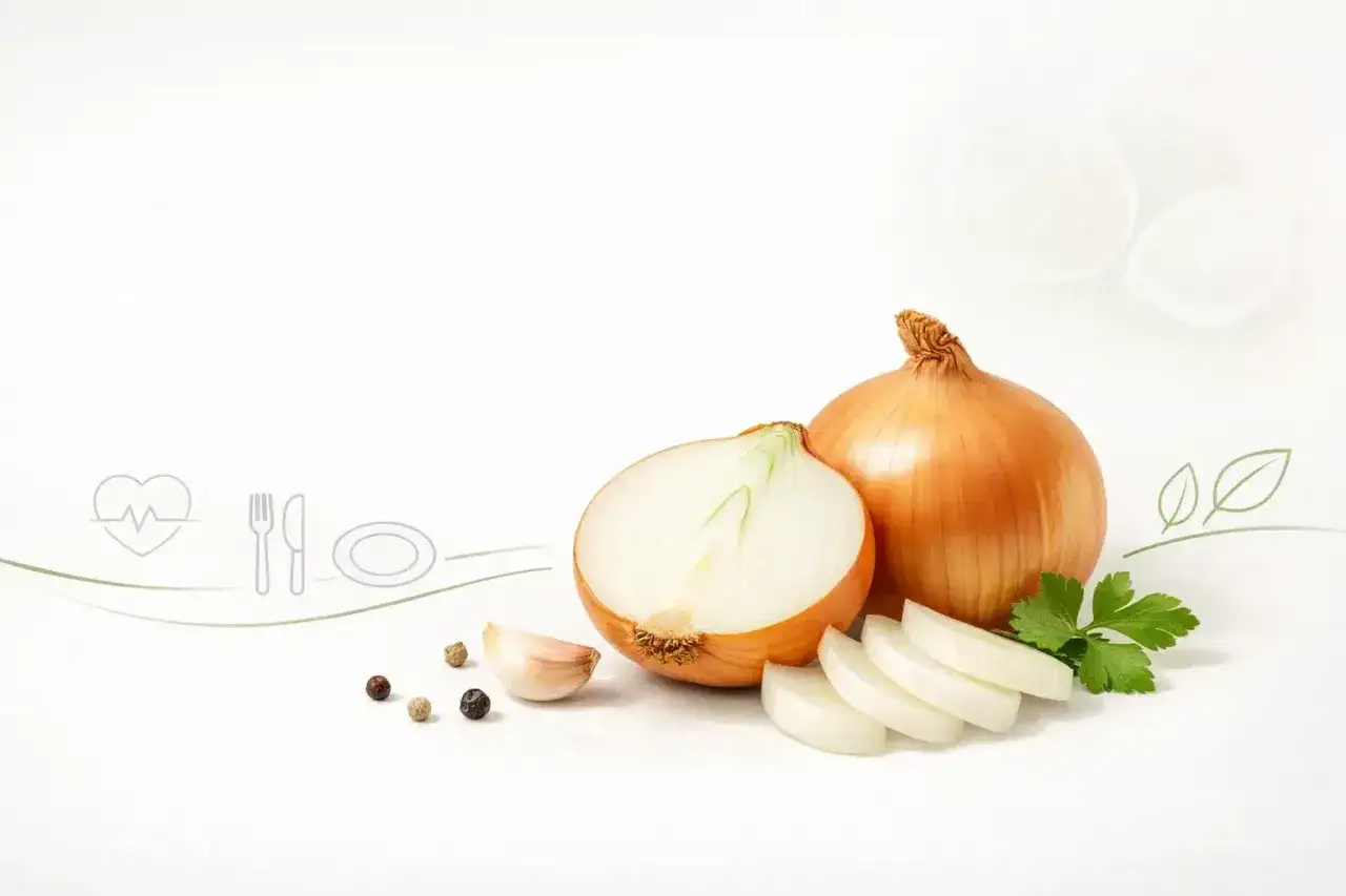 Cebula, źródło węglowodanów, w towarzystwie czosnku i ziół, symbolizuje zdrową dietę.